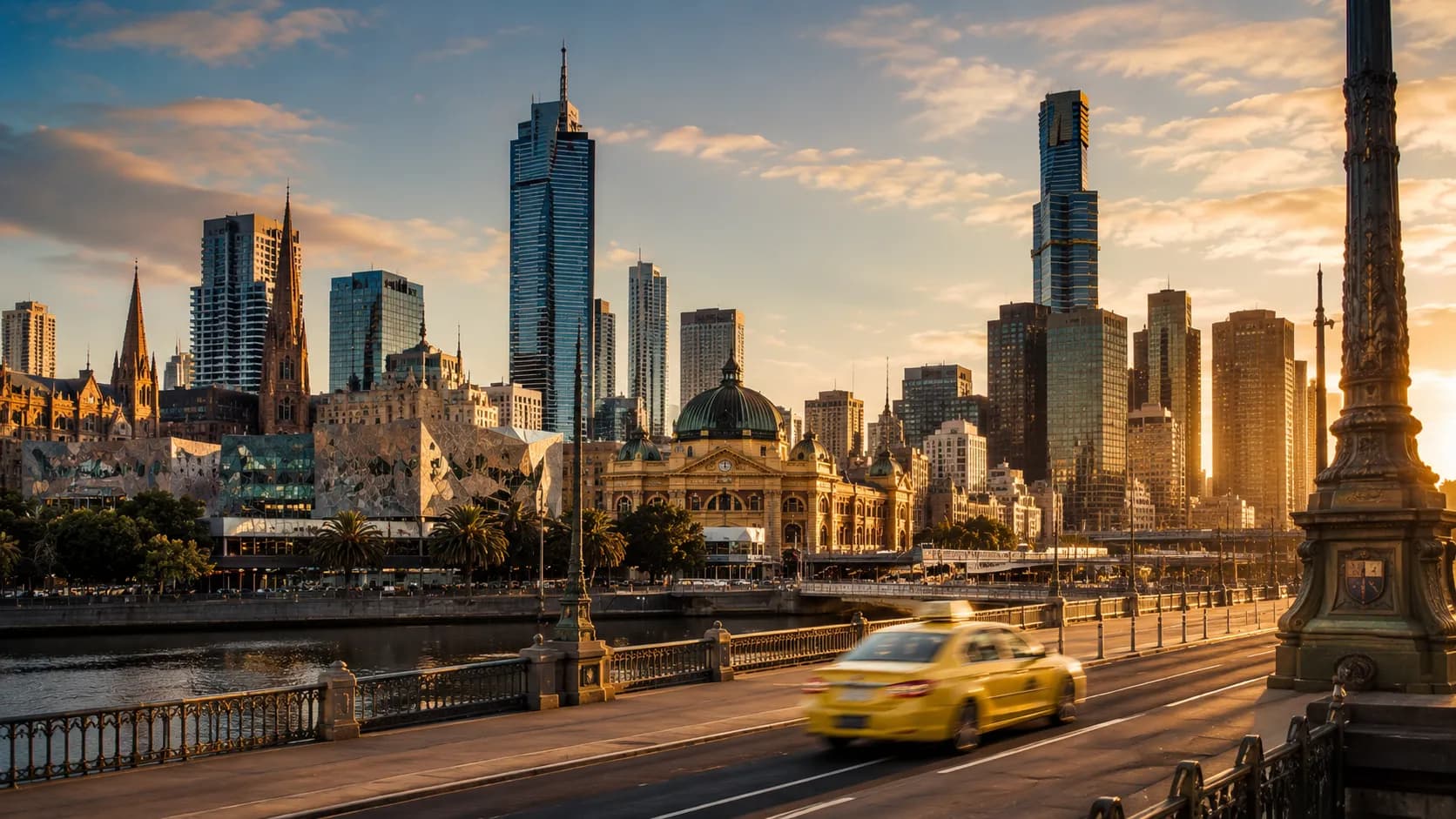 Melbourne city skyline at dusk with taxi on Princes Bridge